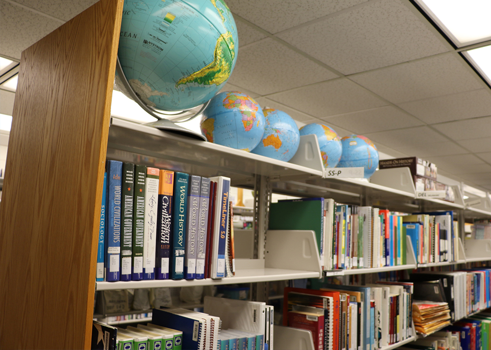 Shelf of books and teacher resources at the UD Education Resource Center